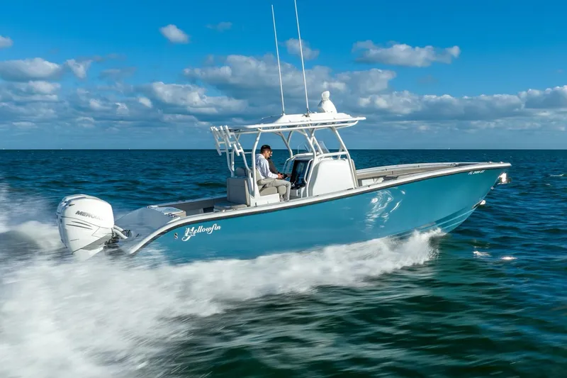 Slide: The Image of 2025 Yellowfin 32 boat cruising on open water. - 7