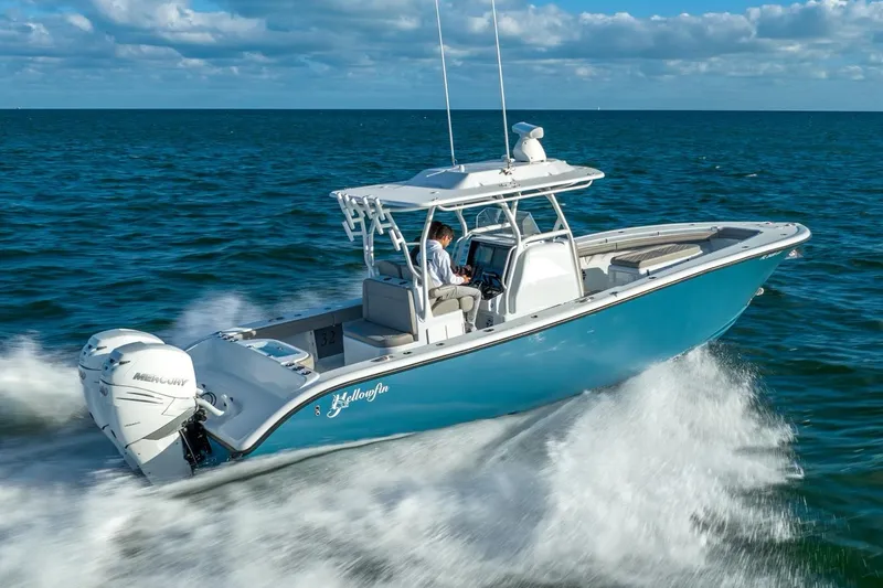 Slide: The Image of 2025 Yellowfin 32 boat cruising on open water. - 8