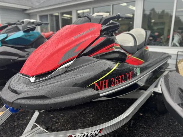 Slide: The Image of 2023 Kawasaki Waverunner Jet Ski STX in black and red. - 1