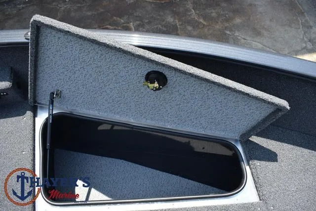 Slide: The Image of Open storage compartment on a 2025 Lund 1675 Adventure SS boat. - 14