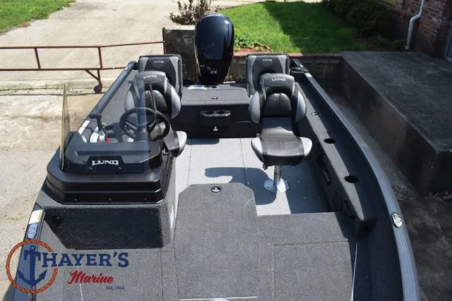 Slide: The Image of 2025 Lund 1675 Adventure SS fishing boat interior with seating and steering console. - 20