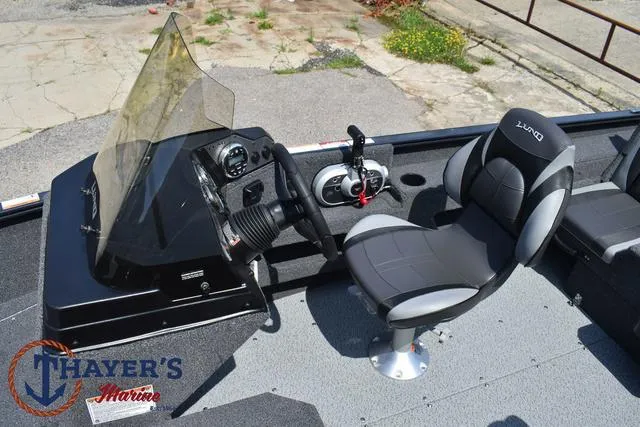 Slide: The Image of 2025 Lund 1675 Adventure SS boat interior with steering console and seating. - 26