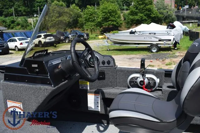 Slide: The Image of Interior of 2025 Lund 1675 Adventure SS boat with steering wheel and seating. - 27