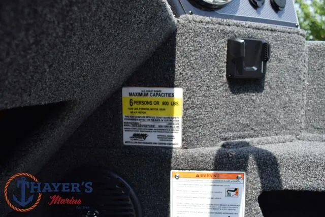 Slide: The Image of 2025 Lund 1675 Adventure SS boat capacity label and dashboard details. - 29