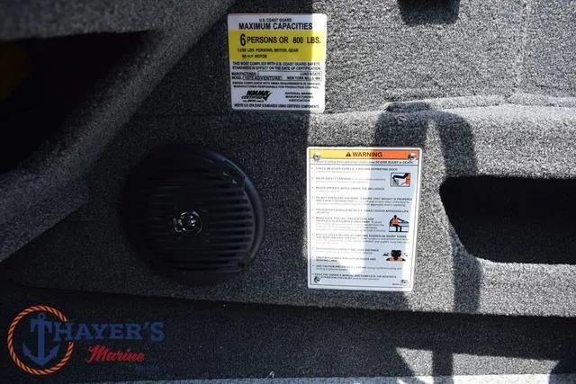 Slide: The Image of 2025 Lund 1675 Adventure SS boat interior with capacity and warning labels. - 30