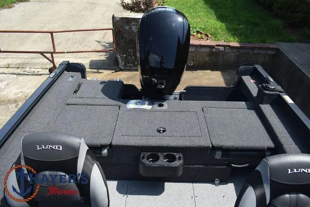 Slide: The Image of 2025 Lund 1675 Adventure SS boat interior with motor and seating. - 35