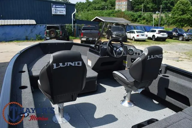 Slide: The Image of 2025 Lund 1675 Adventure SS boat interior with two seats and steering console. - 37