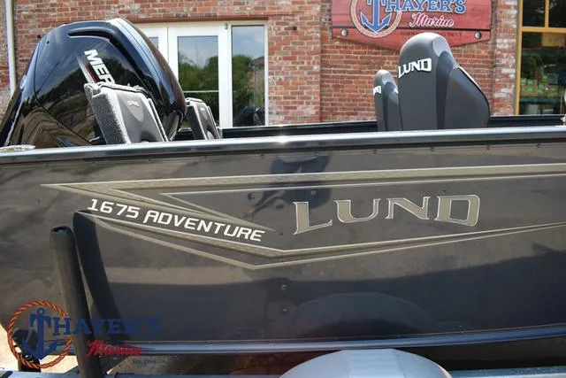 Slide: The Image of 2025 Lund 1675 Adventure SS boat at Thayer's Marine dealership. - 4