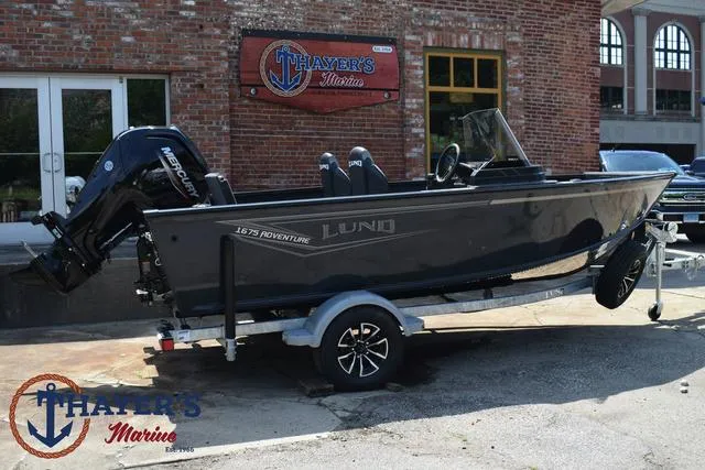 Slide: The Image of 2025 Lund 1675 Adventure SS boat on trailer outside Thayer's Marine. - 40