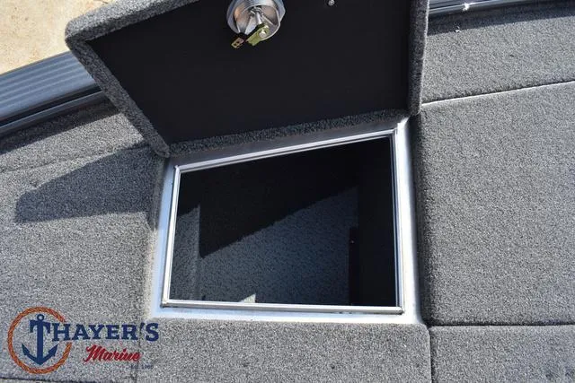 Slide: The Image of Open storage compartment on 2025 Lund 1875 Pro-V Bass XS boat at Thayer's Marine. - 20