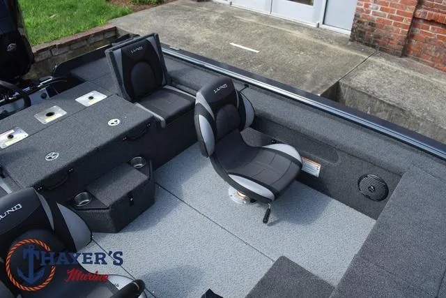 Slide: The Image of 2025 Lund 1875 Pro-V Bass XS boat interior with seating and storage compartments. - 22