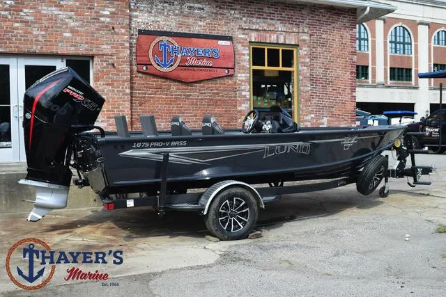 Slide: The Image of 2025 Lund 1875 Pro-V Bass XS boat on trailer at Thayer's Marine dealership. - 3