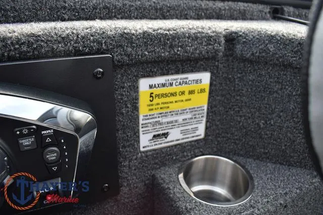 Slide: The Image of Close-up of 2025 Lund 1875 Pro-V Bass XS boat's control panel and capacity label. - 30