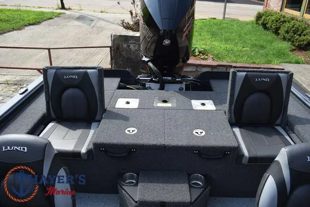 Slide: The Image of 2025 Lund 1875 Pro-V Bass XS boat interior with seating and motor. - 31
