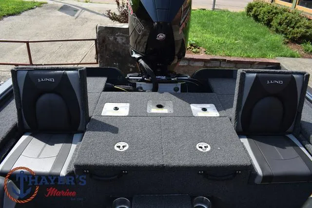 Slide: The Image of 2025 Lund 1875 Pro-V Bass XS boat interior with motor and seating. - 34