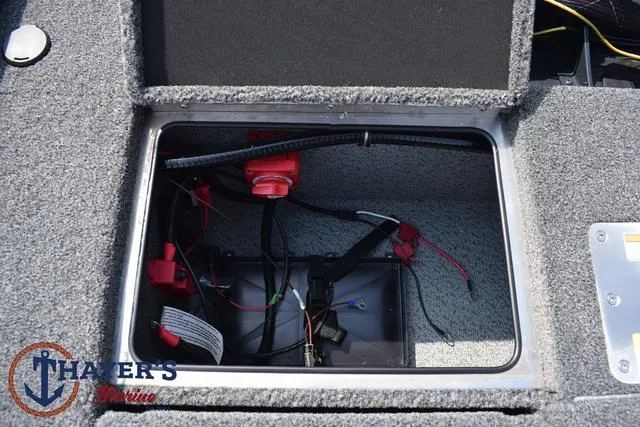 Slide: The Image of Battery compartment of 2025 Lund 1875 Pro-V Bass XS boat with wiring and connections. - 38