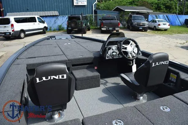 Slide: The Image of 2025 Lund 1875 Pro-V Bass XS boat interior with steering console and seating. - 41