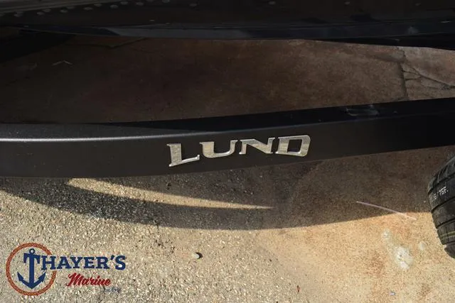 Slide: The Image of Lund 1875 Pro-V Bass XS 2025 boat at Thayer's Marine dealership. - 7