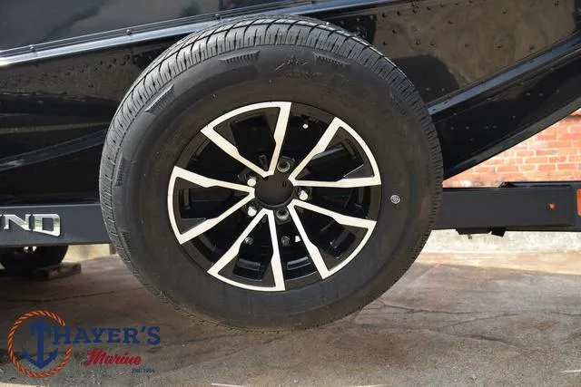Slide: The Image of Close-up of 2025 Lund 1875 Pro-V Bass XS trailer wheel at Thayer's Marine. - 8