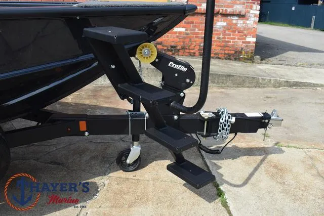 Slide: The Image of 2025 Lund 1875 Pro-V Bass XS boat trailer with Profile winch and Thayer's Marine logo. - 9