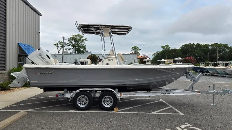 Slide: The Image of 2025 Bulls Bay 2200 boat on a trailer in a parking lot. - 5
