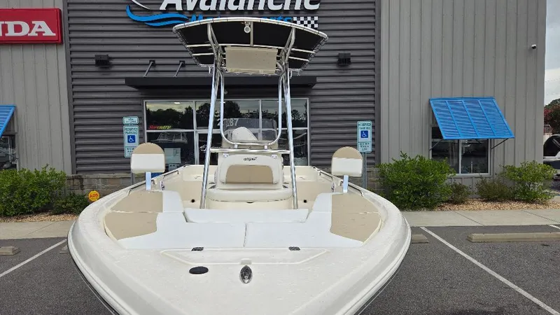 Slide: The Image of 2025 Bulls Bay 2200 boat displayed outside dealership. - 7