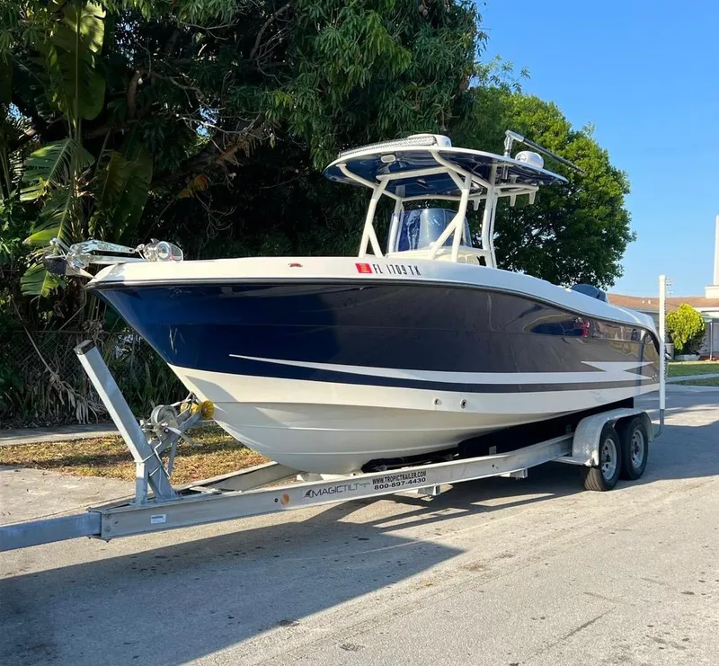 Slide: The Image of 2006 Hydra-Sports Vector 2500 CC boat on a trailer, parked outdoors. - 1