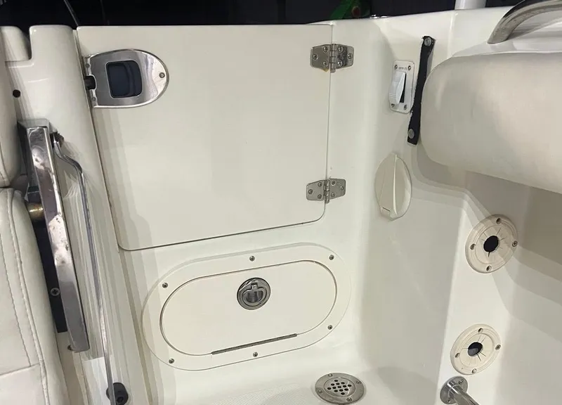 Slide: The Image of 2006 Hydra-Sports Vector 2500 CC boat interior, showing storage compartments and fixtures. - 13