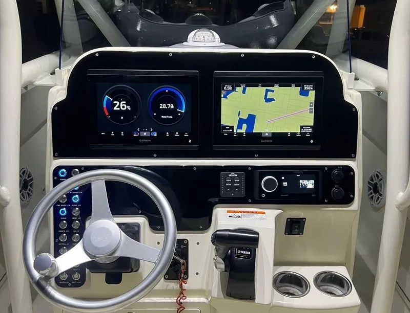 Slide: The Image of 2006 Hydra-Sports Vector 2500 CC boat dashboard with navigation and control systems. - 4