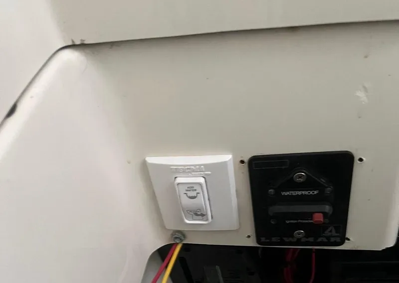 Slide: The Image of 2006 Hydra-Sports Vector 2500 CC boat control panel with switches and wiring. - 8