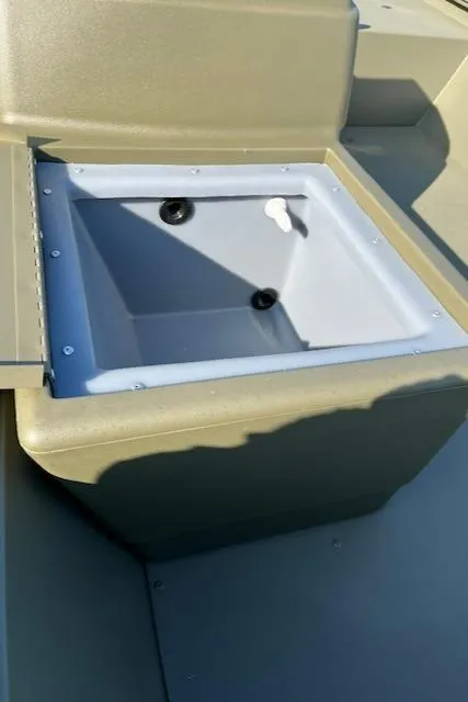 Slide: The Image of 2024 Tracker Grizzly 1648 SC boat interior with storage compartment. - 3