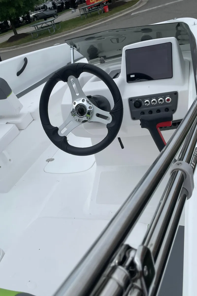 Slide: The Image of 2024 Tahoe T18 boat cockpit with steering wheel and control panel. - 3
