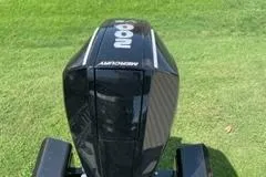 Slide: The Image of 2024 Regency 230 DL3 boat engine on grass. - 7