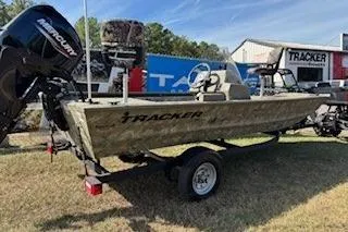 The Image of 2024 Tracker Grizzly 1648 SC boat on trailer, displayed outdoors. - 0