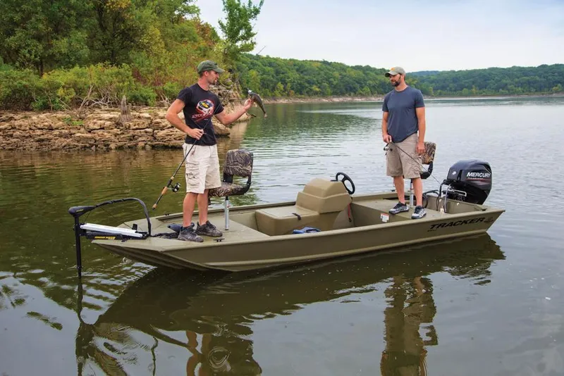 Slide: The Image of 2024 Tracker Grizzly 1648 SC boat with camo seat and trolling motor. - 3