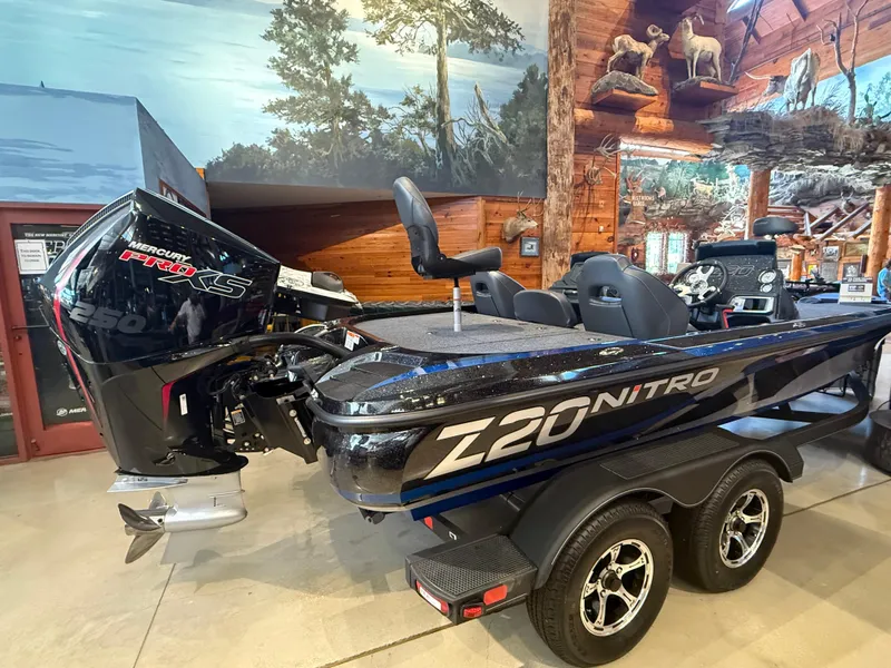 Slide: The Image of 2024 Nitro Z20 boat with Mercury Pro XS engine in a showroom setting. - 1