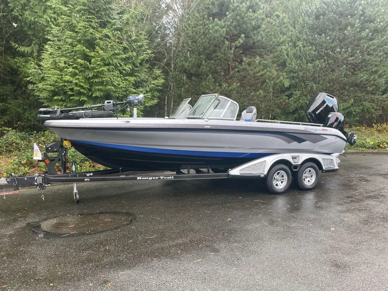 The Image of 2024 Ranger 621FS Pro boat on trailer, parked outdoors. - 0