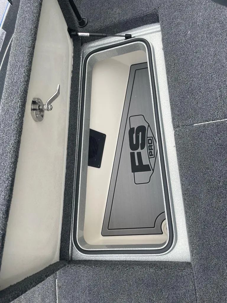 Slide: The Image of 2024 Ranger 621FS Pro storage compartment with FS Pro logo. - 16