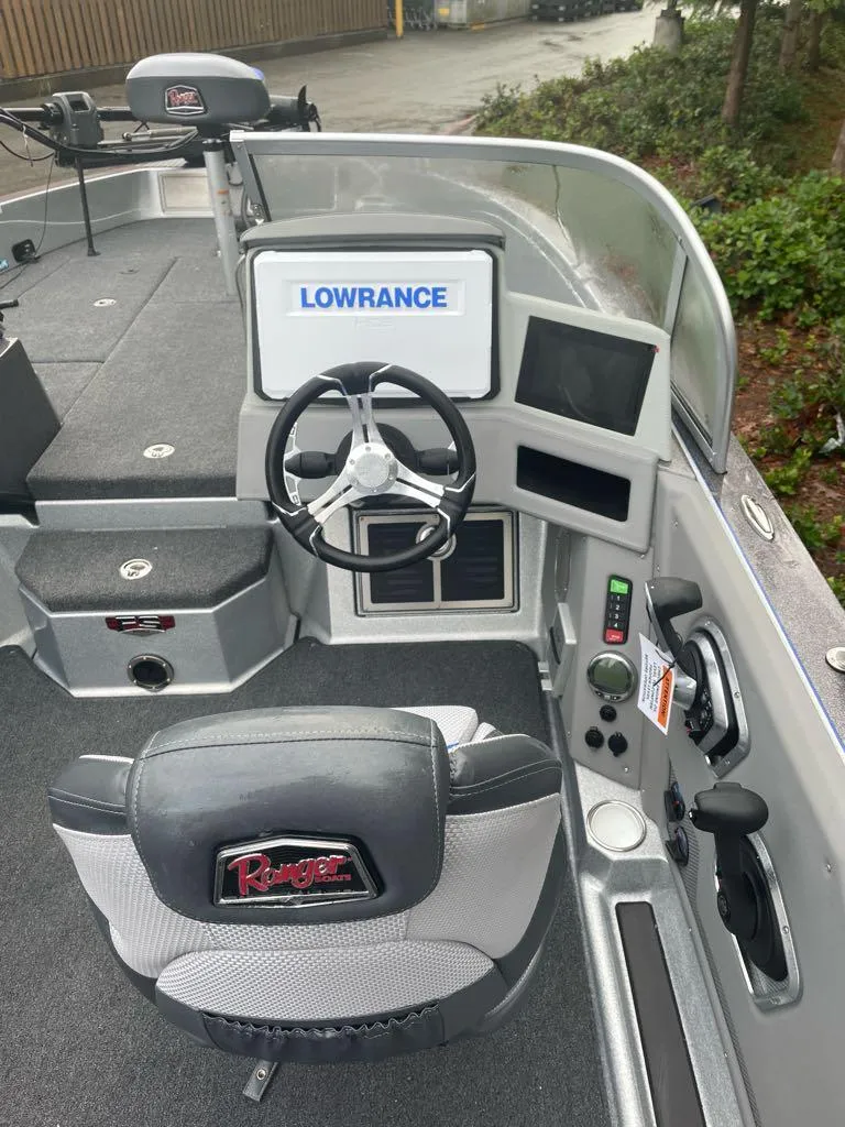 Slide: The Image of 2024 Ranger 621FS Pro boat interior with Lowrance electronics and steering wheel. - 3