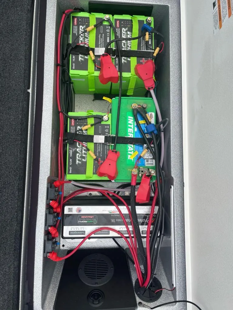Slide: The Image of 2024 Ranger 621FS Pro boat battery compartment with Tracker batteries and wiring. - 5