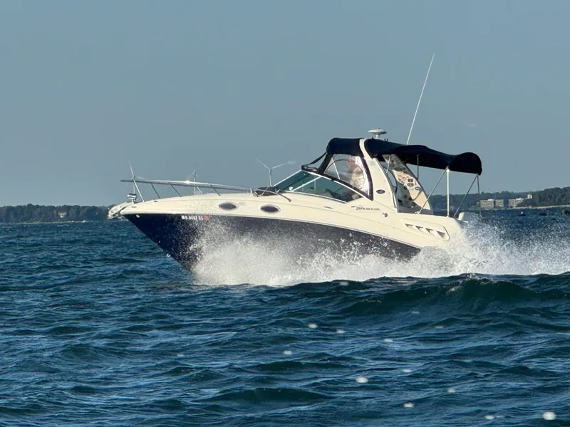 Slide: The Image of 2006 Sea Ray 260 Sundancer cruising on open water. - 0