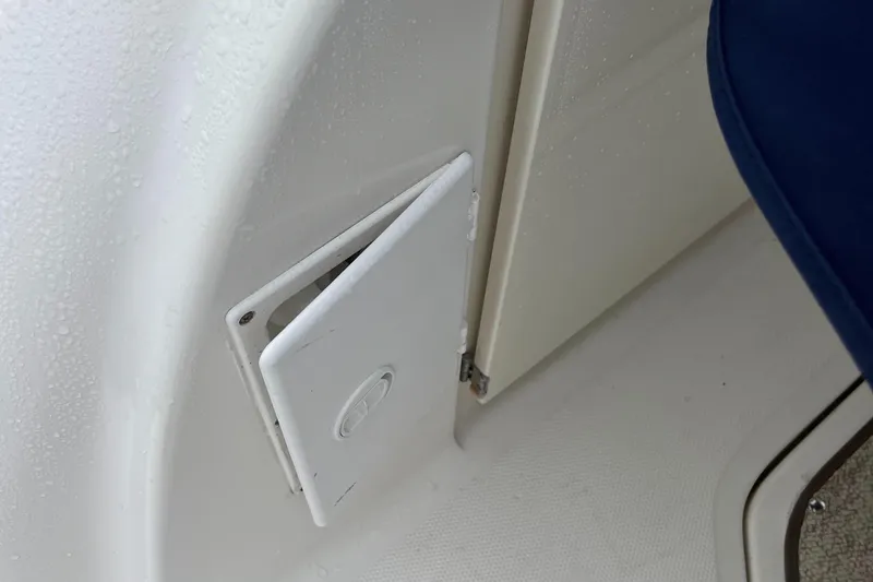 Slide: The Image of 2006 Sea Ray 260 Sundancer interior compartment with white access panel. - 42