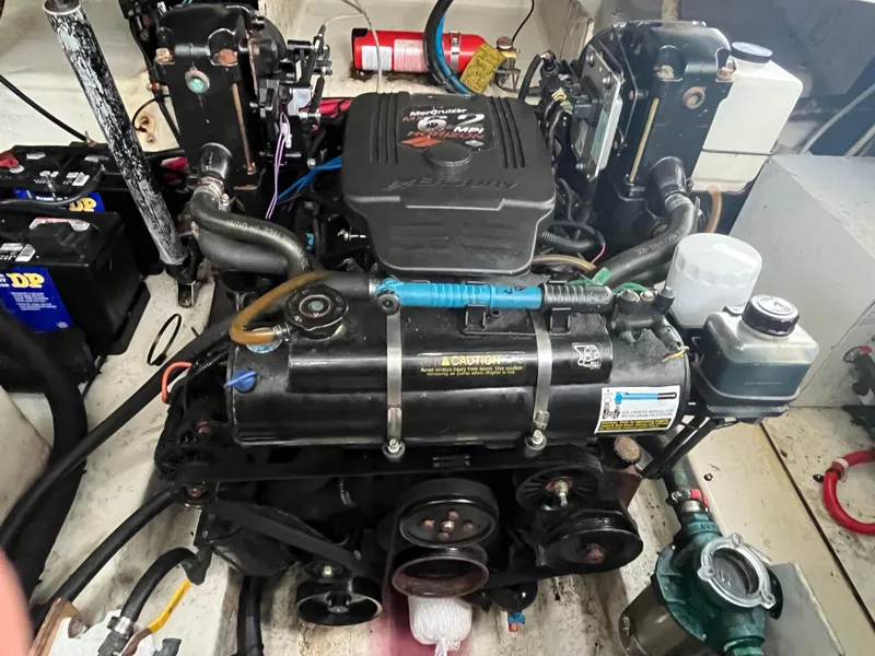 Slide: The Image of Engine compartment of a 2006 Sea Ray 260 Sundancer boat. - 43