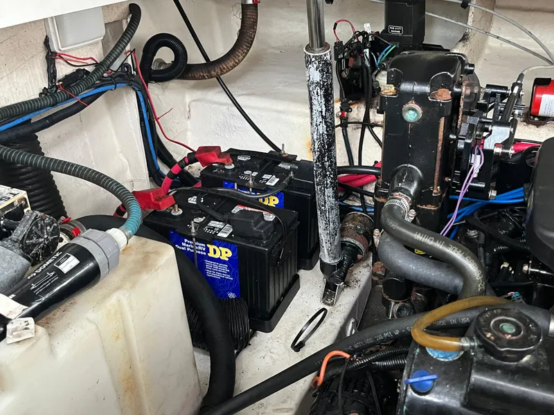 Slide: The Image of 2006 Sea Ray 260 Sundancer engine compartment with batteries and wiring. - 44