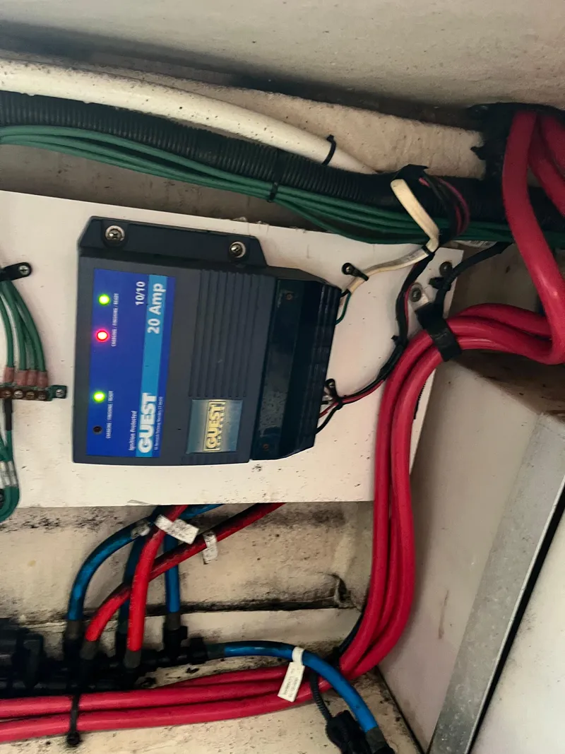 Slide: The Image of Battery charger and wiring in a 2006 Sea Ray 260 Sundancer boat. - 46