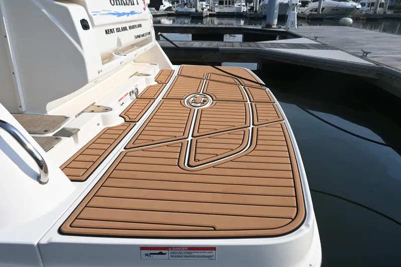 Slide: The Image of 2018 Sea Ray Sundancer 260 swim platform with custom teak-style decking. - 11