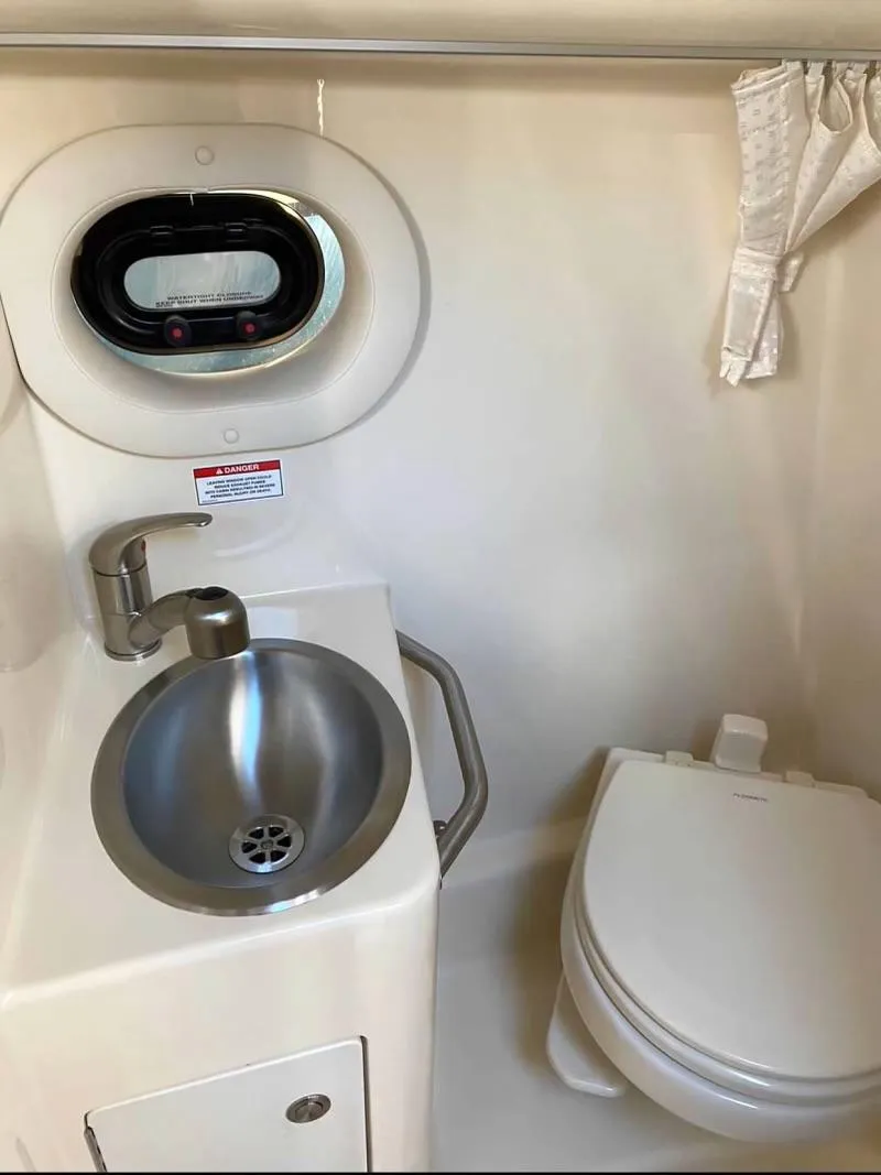 Slide: The Image of 2018 Sea Ray Sundancer 260 bathroom with sink and toilet. - 30
