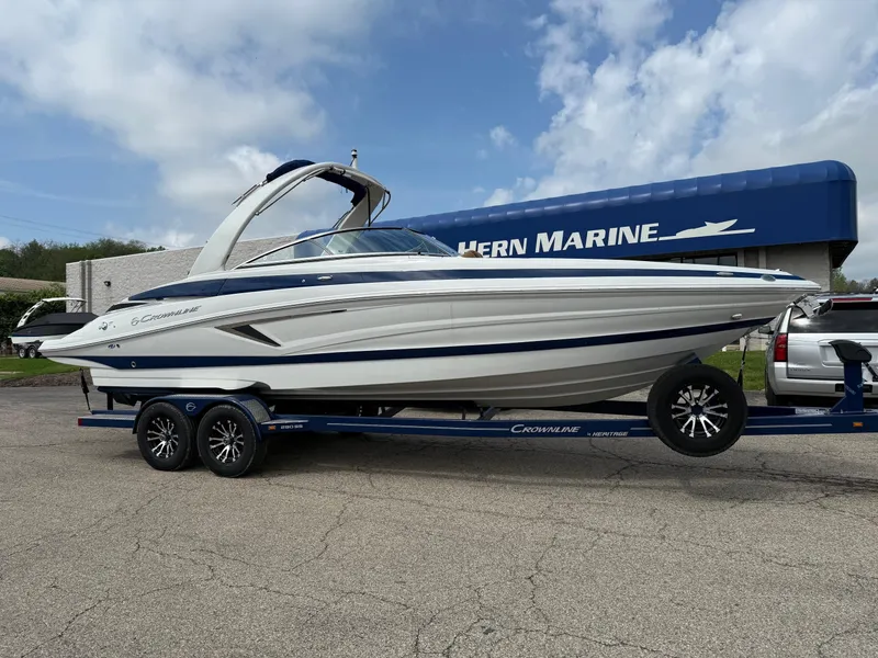 The Image of 2025 Crownline 290 SS boat on trailer at Hern Marine dealership. - 0