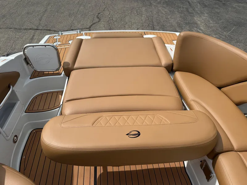 Slide: The Image of 2025 Crownline 290 SS boat with tan leather seating and teak flooring. - 4