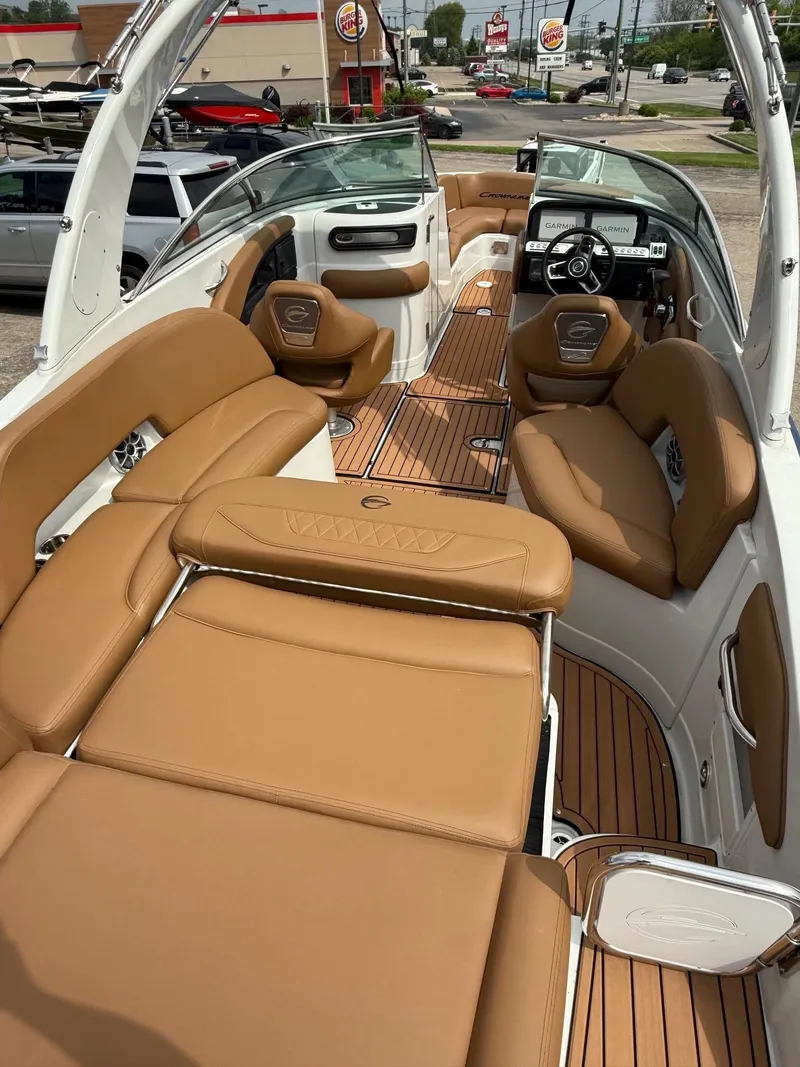 Slide: The Image of 2025 Crownline 290 SS boat interior with tan leather seating and sleek design. - 6